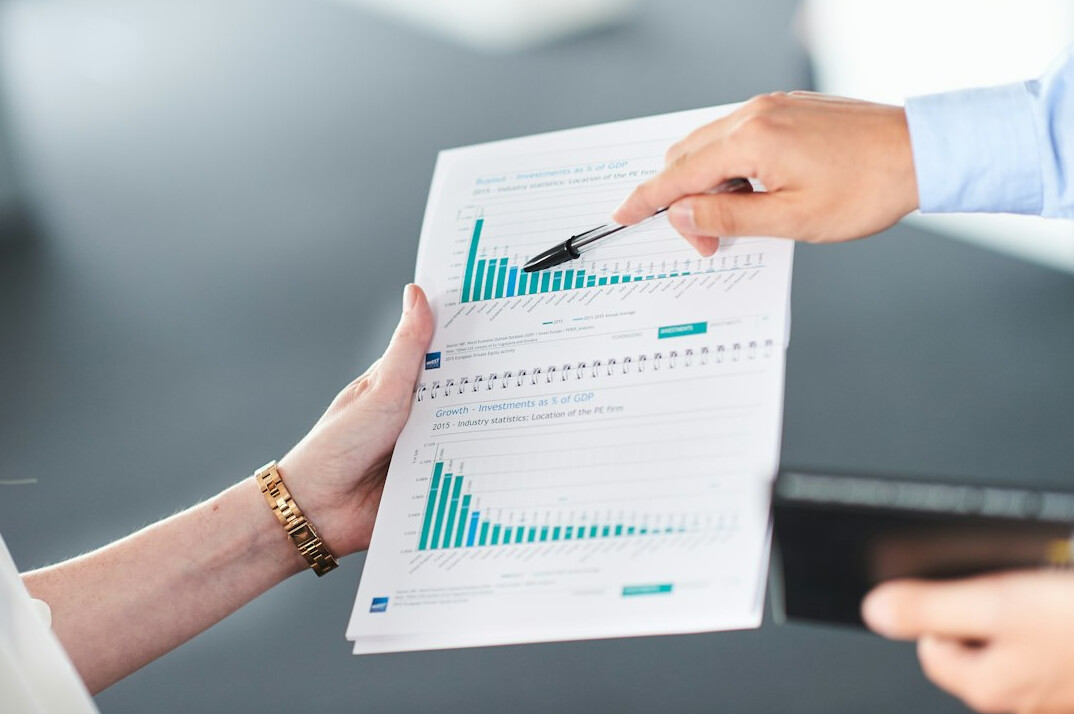financial analyst reviewing charts